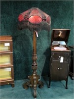 Carved mahogany floor lamp with lions' heads