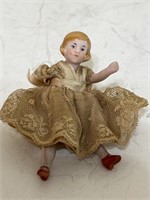 Bisque doll missing hand
