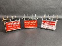 Three Coca-Cola Shopping Cart Bottle Holders