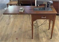 Vintage Sears Kenmore sewing machine and cabinet