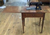 Vintage singer sewing machine and cabinet