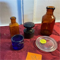Four miscellaneous glass and two brown bottles
