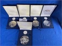 Five ASE Silver Dollars