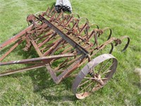 Old 8ft. wheel cultivator on steel wheels