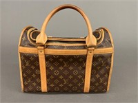 Louis Vuitton dog carrier.