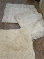 THREE white bathroom rugs