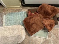 Collection of bathroom rugs.