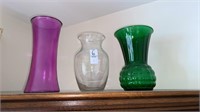 3 glass vases. About 9 inches tall