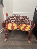 Red painted metal garden seat