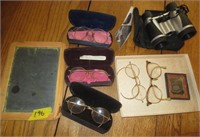 Old glasses, slate board, binoculars