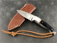 Fixed bladed knife with horn and seal scales and b