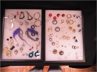 Two containers of pierced earrings