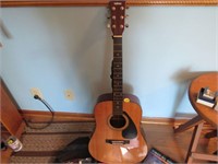 Guitar, case, and books