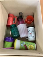 Box of plastic cups and two bags