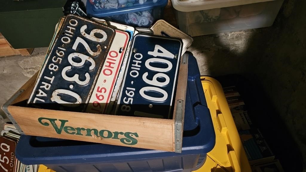 Assorted Old License Plates in Vernon Crate