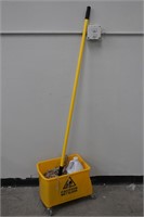 Rolling mop bucket and mop