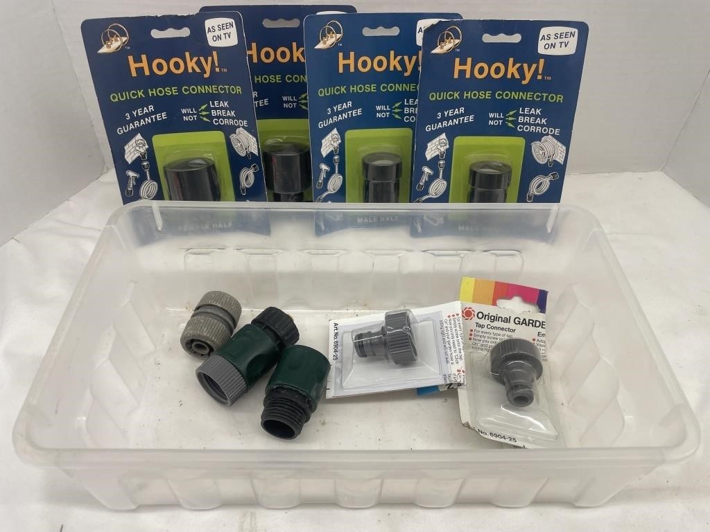 Lot of 9 hose connectors in a little storage box.