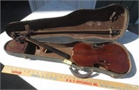 Broken violin in case