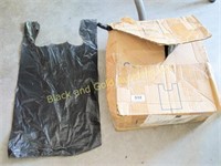 Full box of small, black, T-shirt style bags