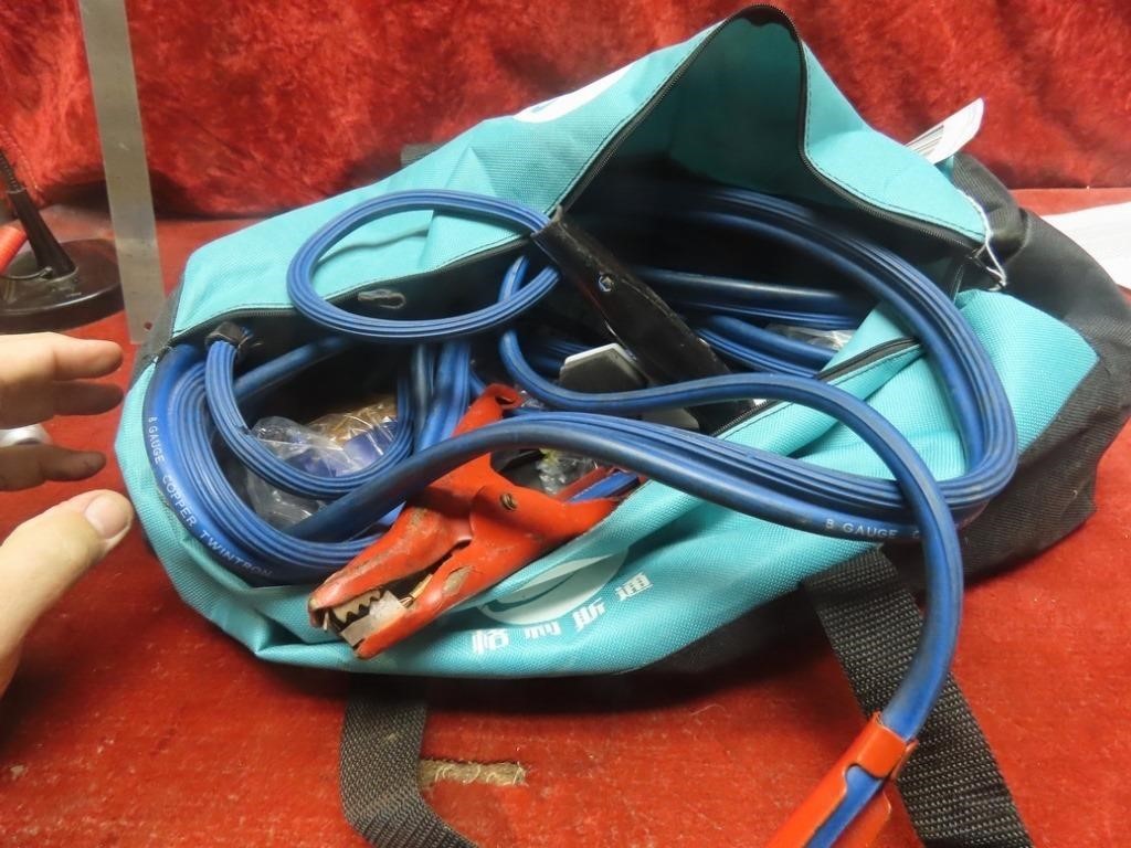 Jumper cables, tools, bag.