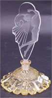 An 8" high yellow perfume bottle with clear