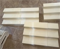 THREE step organizers for cabinets.