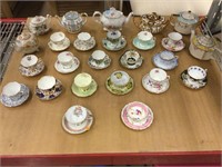 Assorted teapots, teacups and saucer.