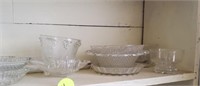 SHELF OF GLASS TRAYS AND BOWLS