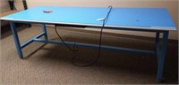 Large blue work table with plug-in outlets