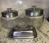 Covered glass jars and butter dish