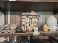Eggs, advertising, wood, and glass, and plastic.