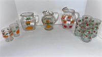 (3) orange glass pitchers w/ (2) small glasses,