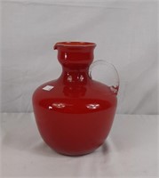 Red pitcher with glass handle