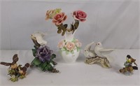 Collection of bird sculptures and a vase