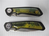(2) Folding knives with stainless steel blades.