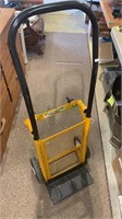 Black and yellow furniture dolly. Needs a few new