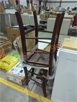2 brown wooden chairs