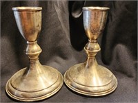 Pair of sterling candlesticks.   Weighted by