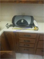 Large George Foreman Grilling Machine.  Used very