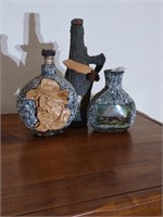 Group of vintage bottles. 2 have a stone-like