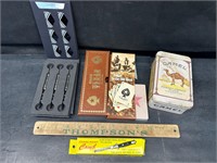 Darts, cards, camel tin, comb