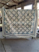White and Blue Multicolored Quilt
