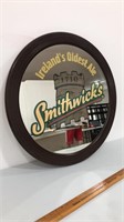 Large Smithwicks mirrored sign with wooden frame.