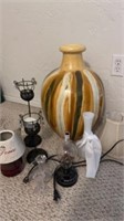 Pottery vase has crack, milkglass vase, candle