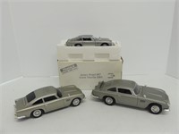 BOX: THREE JAMES BOND ASTON MARTIN DIECAST CARS