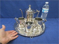 nice silver plated tea set on round tray