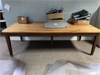 8 foot wood top table. Contents on table sold