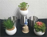 Four stainless steel cups three faux succulents