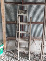 Two wooden ladders -- step and short