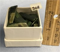 Small box of various sized polished pieces of jade